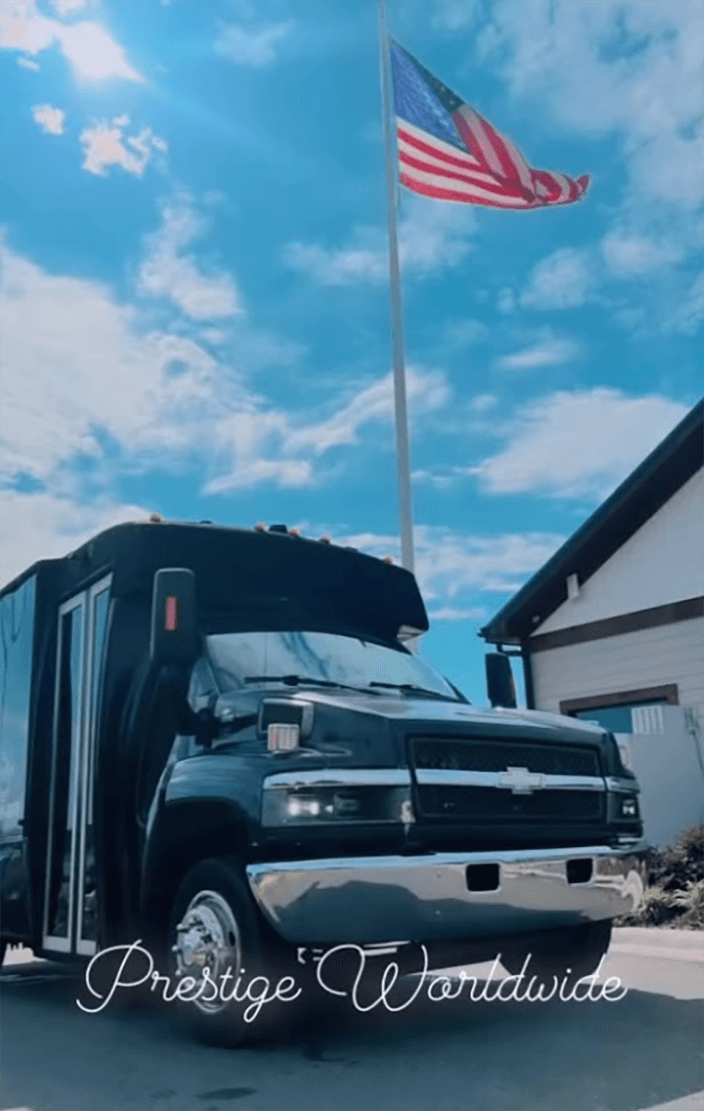 Prestige Worldwide luxury transportation team and vehicle